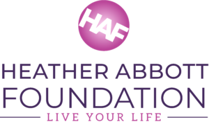 The official logo for the Heather Abbott Foundation. The name is spelled out in purple letters with the tagline "Live Your Life" underneath. Above the name is a pink/purple circle with the acronym HAF